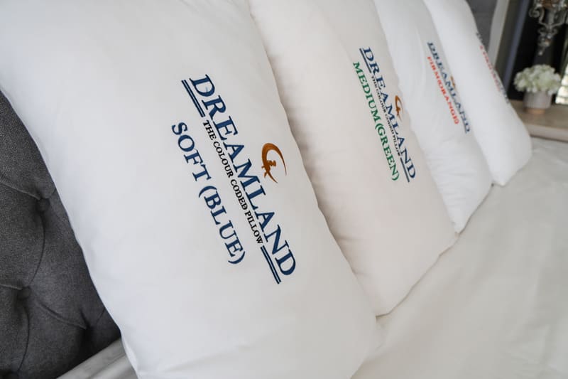Close angled view of the four colour coded pillows