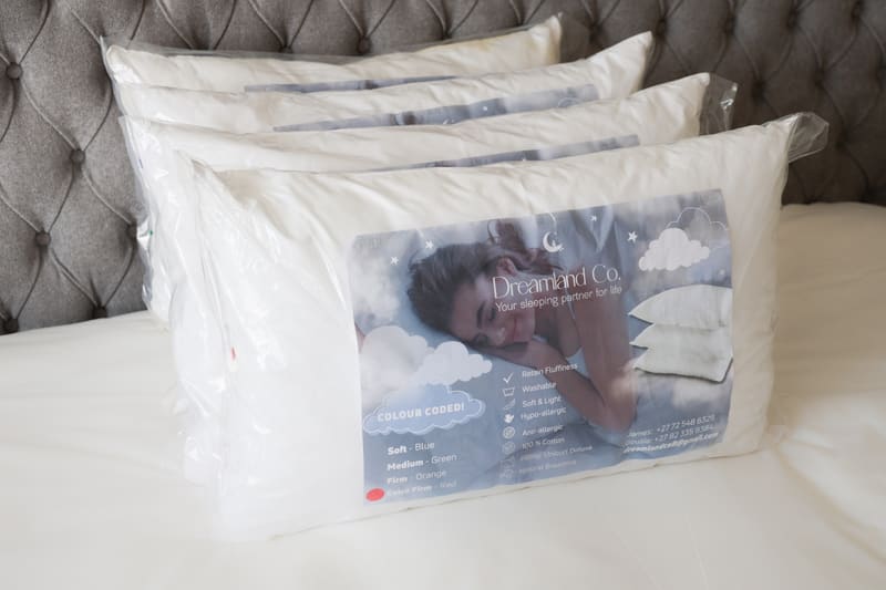 A stack of packaged Dreamland pillows ready for delivery
